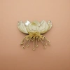 A golden lotus-shaped fruit plate for home living room fruit plate ceramic decoration details Picture